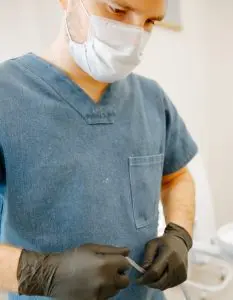 Man in a blue scrub suit 