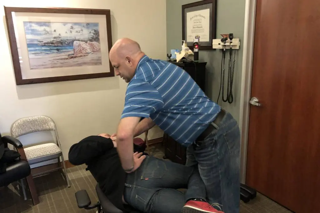 Doctor Hogan at Hogan Spine & Rehab adjusting a patient's back.