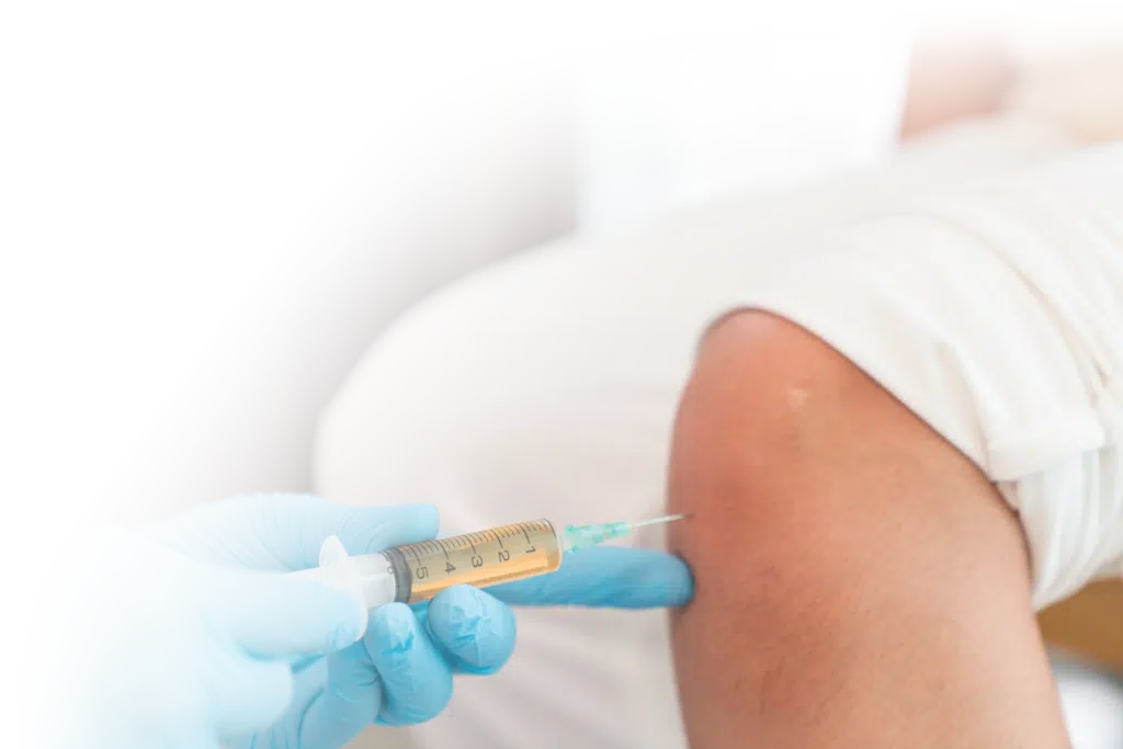 Patient receiving stem cell therapy injection at Hogan Spine & Rehabilitation