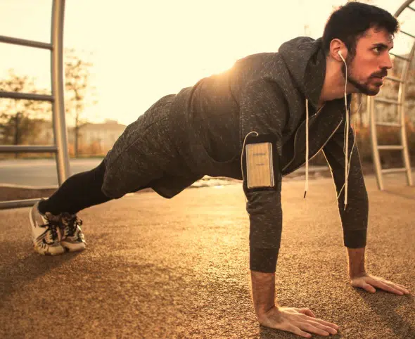 a man doing a pushup Strength Exercises