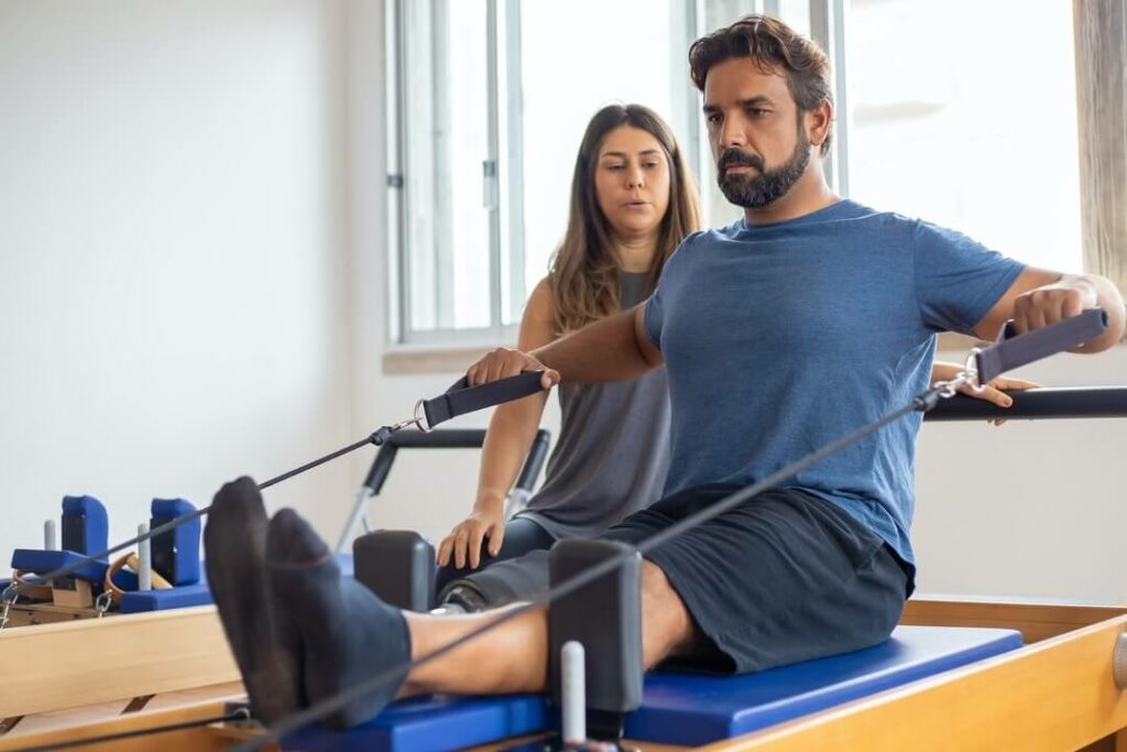 Therapist helping a patient to do the physical therapy