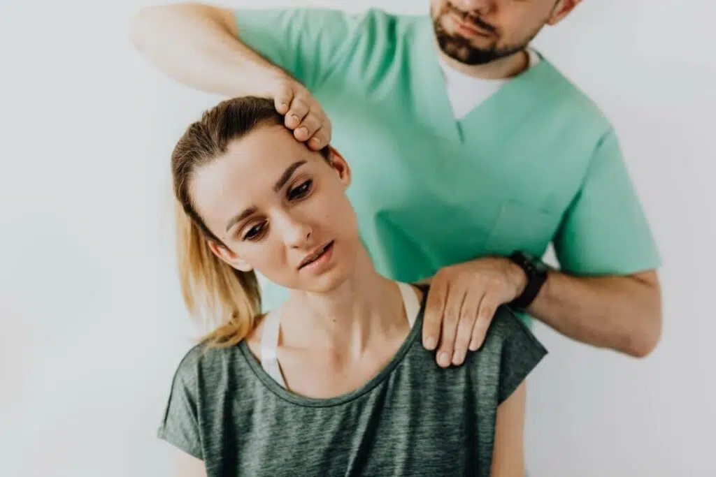 Chiropractor doing the chiropractic treatment to the patient