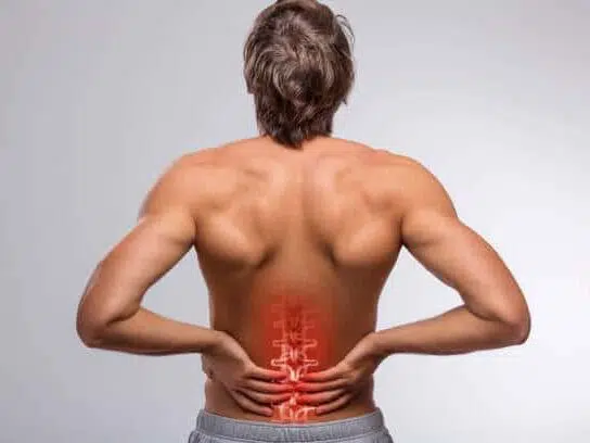 back of a man with lower back pain illustrated 