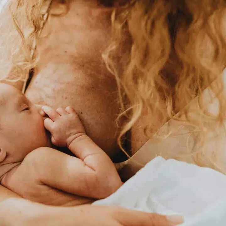 woman breastfeeding her baby
