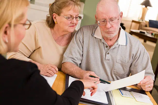 senior couple having a meeting with their insurance advisor