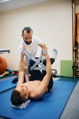 The phiysical therapist doing a physical therapy in sugar land for his patient