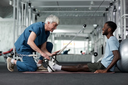 physical therapist doing a therapy for her client