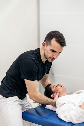 therapist performing chiropractic care for personal injury treatment