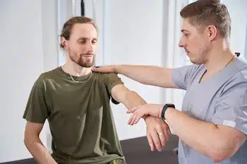 patient treated for chronic pain prevention by physical therapist | benefits of physical therapy